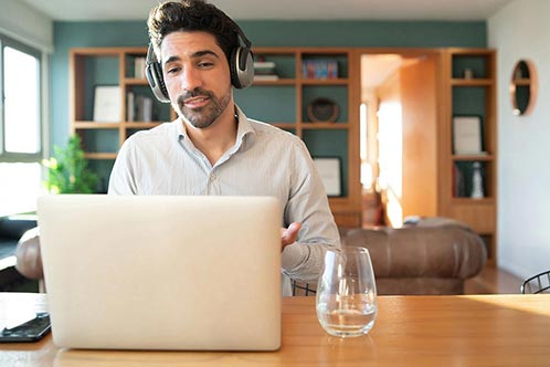 Young Man Work in Video Call With Laptop From Home